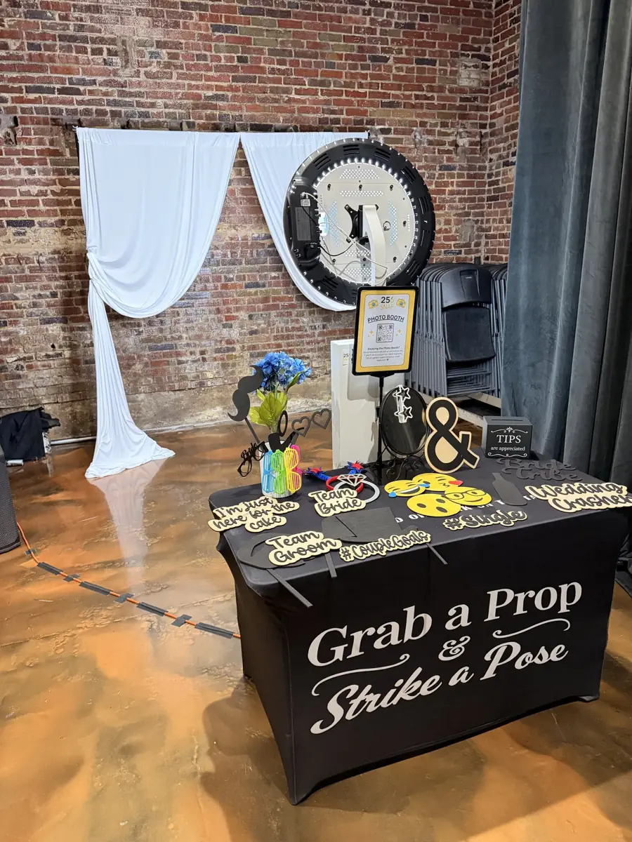 256Snap photo booth set up with a prop table ready for guests